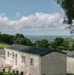 Image of caravans on the park with sea in background